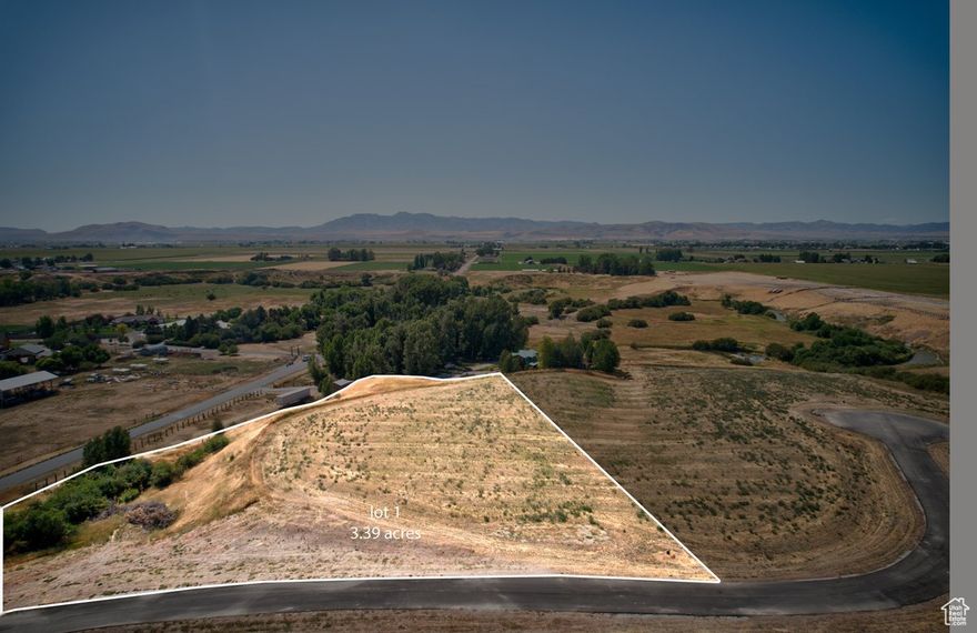A beautiful 3.39 acre homesite with privacy, farmland, and sweeping mountain views. Just 15 minutes from Cherry Peak Ski Resort, it offers the perfect blend of open space and seclusion ideal for a year-round home or a private recreational retreat.