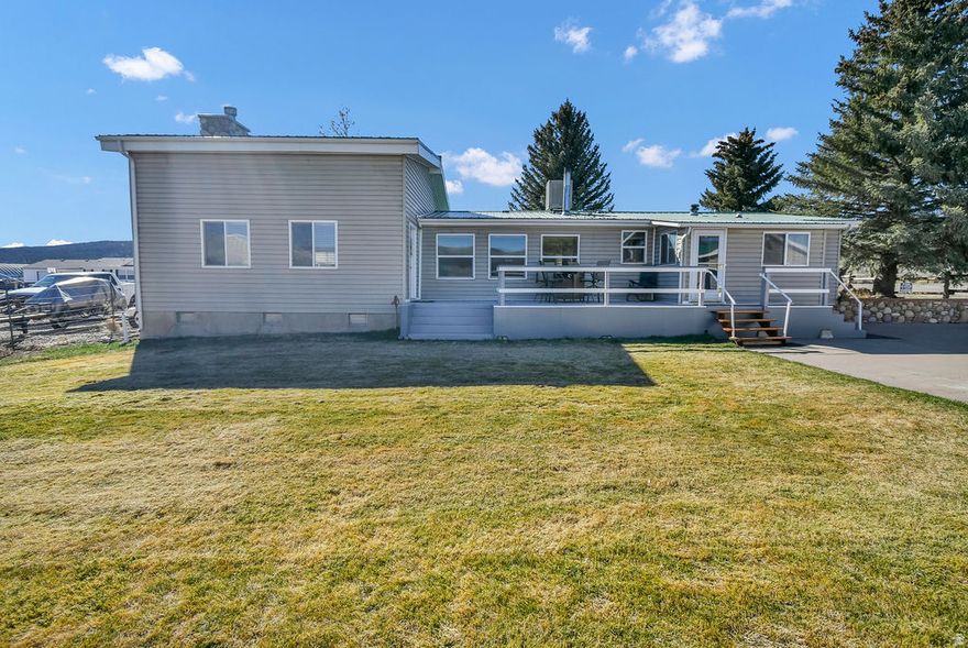1,900 sq ft home on 0.50 acres with 0.50 share of Rosebud Irrigation. Propane heat, wood stove, large fireplace, and 27' x 36' addition. Features include a 30' x 50' heated detached shop, 2-car garage with shed, RV parking, and east-facing deck.