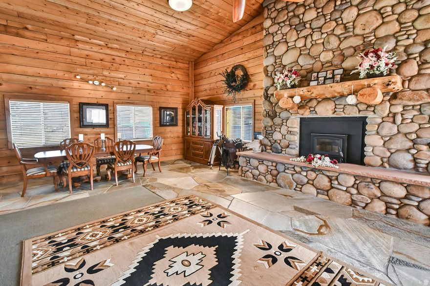 1,900 sq ft home on 0.50 acres with 0.50 share of Rosebud Irrigation. Propane heat, wood stove, large fireplace, and 27' x 36' addition. Features include a 30' x 50' heated detached shop, 2-car garage with shed, RV parking, and east-facing deck.
