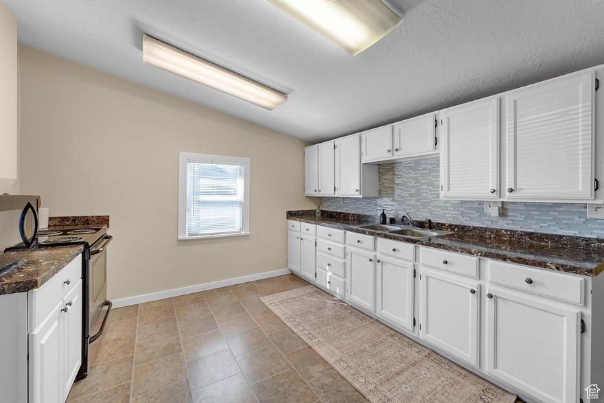 Welcome home to this adorable charmer! This darling two bedroom, one bathroom home blends cozy character with thoughtful updates. You'll love the remodeled kitchen, stylish and functional for everyday living. Major upgrades include a 5 year old roof, furnace and central air unit and 1 year old water heater. 90% of the plumbing has been updated as well! The spacious yard is a true highlight, perfect for gardening, entertaining, or simply relaxing outdoors. Located close to many amenities including IMC and Costco. Within walking distance, you will find a neighborhood park and Murray High School.