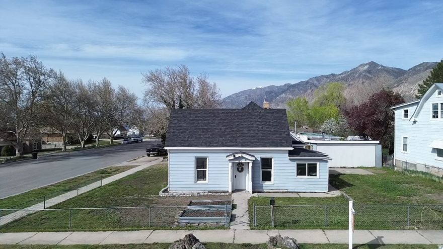 Now with a BRAND NEW roof! No leaks detected, but roof was old so sellers did a complete tear off and redo, with all new ice and water shield, and drip edge (all work done by a licensed roofing company). Good for another 30 years. Seller will also be laying grass seed this week to bring the yard back to life. Beautifully updated home located in desirable Brigham City. This 3-bedroom, 2-bath home features a spacious primary suite with a brand new ensuite bathroom and TWO walk-in closets. Recent upgrades throughout the whole house include new carpet, new LVP flooring, fresh 2-tone paint with trim accents, and updated kitchen and bathrooms giving the home a modern feel that is move-in-ready.  A standout feature is the approximately 400 sq ft unfinished basement crawl space with multiple rooms, 6-foot ceilings, and concrete floors, offering exceptional utility. One crawl space room is already outfitted with shelving for cold storage, other rooms are ready for future creation into an office, bonus room, play area or whatever your needs may be. Attic space could also be turned into living space, as other homes in Brigham City have done. All water and sewer lines in the home are PEX and ABS, electrical has also been updated to make this home a solid investment. Enjoy outdoor living on the back patio, ideal for entertaining; and take advantage of the large corner lot, partially fenced, complete with grape vines and garden boxes, perfect for growing your own garden. Put your finishing touches on the landscaping to make this home truly shine.  The single-car garage offers more than meets the eye. It is double wide with a manual garage door large enough to park one car or small truck, additional man door for access, power, lighting, wall cabinets, and a wood-burning stove for optional heat, making it an excellent workshop space. Additional space on the North side of the garage is perfect for RV or boat parking. Seller may also be willing to leave furniture items inside if buyer would like. Square footage and other information are provided as a courtesy. Buyer and buyer's agent to verify all. Square footage is based on county records and floor plan mapping of the crawl space.