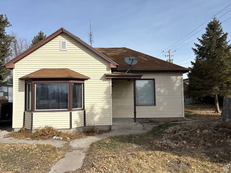Fantastic Opportunity! Charming Starter Home Located in the Heart of Gunnison. This Home Features 3 Bedrooms, 2 Bathrooms, Laminate Flooring, Updated Plumbing, Mature Trees, and Offers Plenty of Potential!