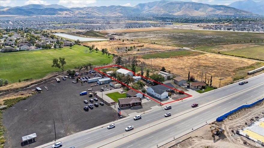 Discover an exceptional opportunity with this prime commercial property located in Riverton. Situated on a frontage lot along 13400 S, this property boasts high visibility and heavy street traffic, making it ideal for a variety of business ventures. Close proximity to Bangerter Highway and Mountain View Village, ensuring convenient access and exposure. Zoning: C-R zoning allows for versatile commercial use, with potential for assemblage with neighboring parcel (33-06-200-061-0000) to accommodate larger developments. The property is currently being used as Residential. Buildings include 4428 square foot home with two mother in law apartments, a small shop, lean-to garage, and large shop approx 40'x60'. Property is also listed under commercial to ensure visibility to all buyers.