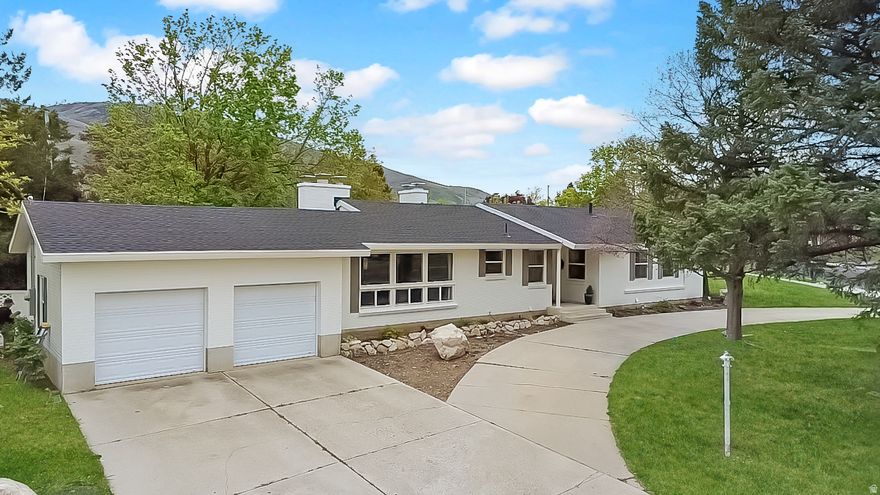 If you've been dreaming of a home with personality, light, and space this is it. Located on Brigham City's east side, this 5-bedroom, 3-bathroom home sits on a large corner lot and immediately draws you in with its freshly painted white exterior and incredible curb appeal. Inside, you'll find a rich, moody ambiance paired with an open, flowing layout and brand-new windows that flood the home with natural light. Thoughtful updates throughout include new garage doors, a brand-new roof installed just last week, and an HVAC system that's only 3 years old. It's the perfect balance of cozy and elevated.