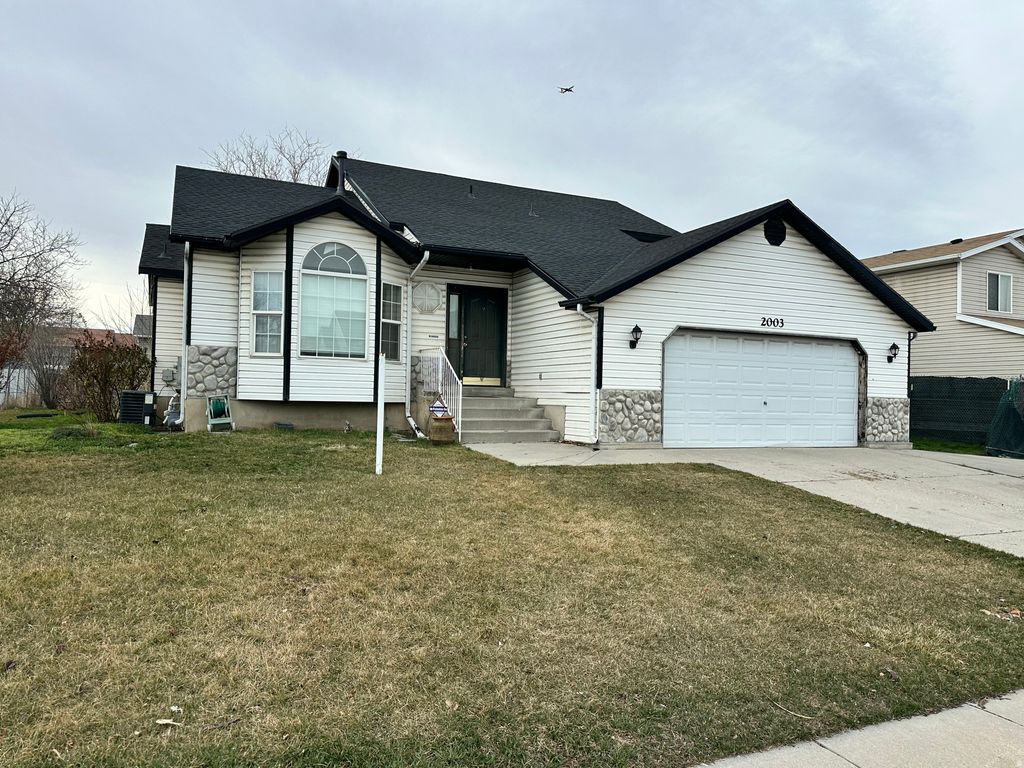 Photo of 2003 W APPLE FARMS RD S, West Valley City, UT 84119 (MLS # 2142521)