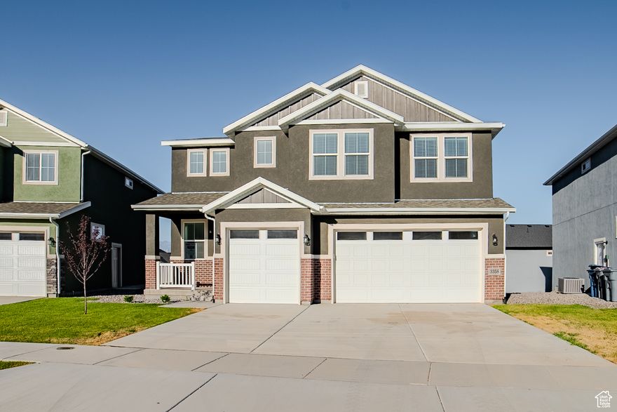 Beautiful finishes: tile backsplash, full tile primary bath, quartz countertops, stainless steel appliances, black railing and black hardware. Park just a block away, beautiful lake views, and walking trail nearby.
