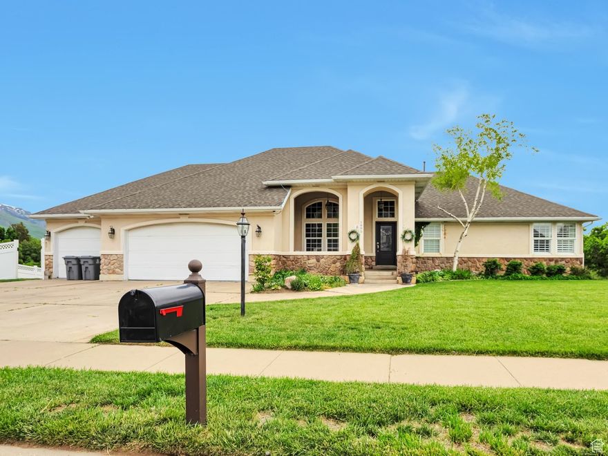 Beautiful Uintah Highlands Rambler with Mother-in-Law Suite and Stunning Views!  Enjoy the ease of main-level living in this highly sought-after Uintah Highlands neighborhood. The spacious primary suite offers an ensuite complete with a separate soaking tub and walk-in shower, plus a massive walk-in closet for all your storage needs.  The heart of the home is a chef's kitchen, featuring white cabinetry, granite countertops, a generous island, and elegant hardwood floors. The kitchen flows into a bright and airy great room with vaulted ceilings, and freshly updated gray paint and new carpet throughout.  Convenient main floor laundry and a half bath just off the kitchen add everyday functionality, while no backyard neighbors provide added privacy and serene views. Downstairs, you'll find a fully finished daylight basement with a private entrance-perfect for a mother-in-law suite or rental potential. It boasts a full second kitchen, an expansive family room, and plenty of space to entertain or host guests.  Additional features include dual water heaters, an oversized 3-car garage, and breathtaking panoramic views of the valley and surrounding mountains.