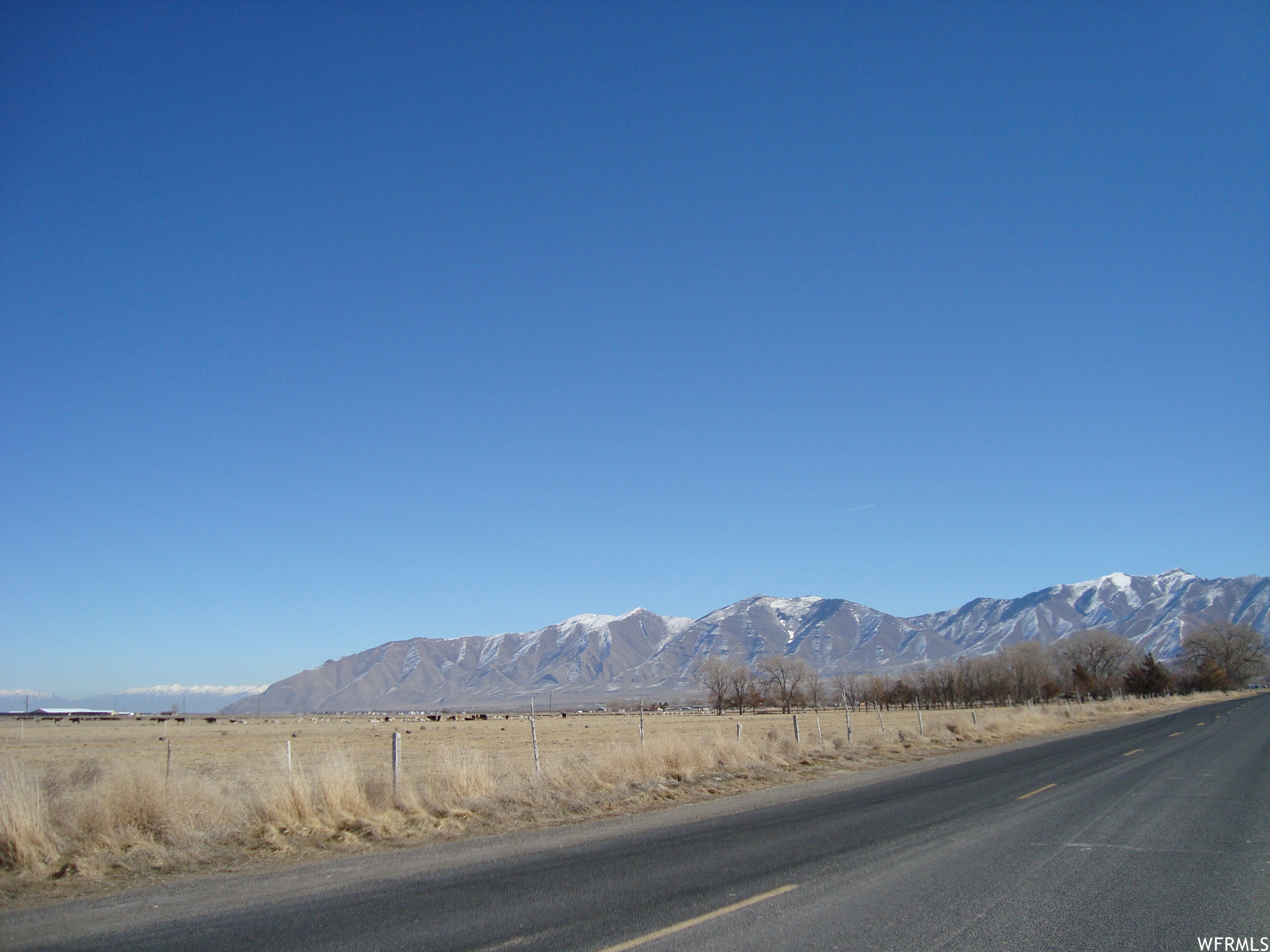 This large acreage located in Erda City, Utah and situated on the hard corner of Erda Way & Sheep Lane ( Mid Valley Highway ) might be the best opportunity in the north end of Tooele County! Just north of the Lakeview Business Park, and the Motorsports Campus, it is right in the path of development! Sale includes water rights.