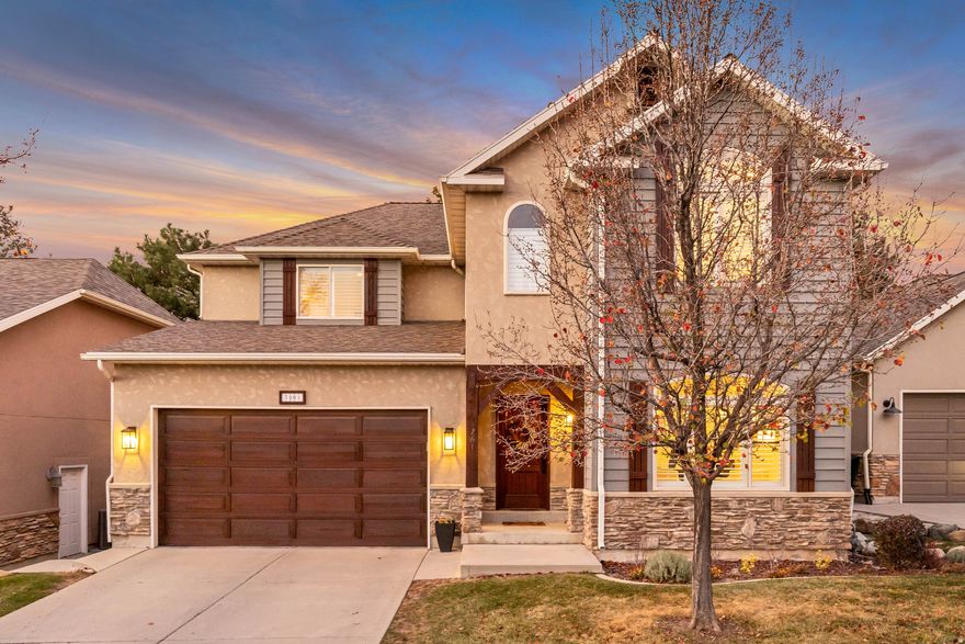This magnificent two-story home in the prestigious, private, gated community of Lantern Hill is perched high on the east bench with breathtaking mountain and valley views. Overlooking Willow Creek Country Club and just minutes from Big and Little Cottonwood Canyons, the location offers exceptional access to world-class skiing, golf, biking, hiking, and outdoor recreation. This extensively updated home features an open, spacious floor plan designed to enhance flow and natural light, with picture windows that frame the surrounding scenery (Frank Loyd Wright would be proud). Main-floor living includes a bright family gathering space adjacent to the dining area and a welcoming kitchen-an ideal layout for everyday living and entertaining. A private office or den near the entryway provides beautiful mountain views and a quiet place to work or relax. The primary suite is a serene retreat with a luxurious ensuite bathroom featuring a Euro-glass shower, a separate soaking tub, and a generous walk-in closet. The lower level is warm and inviting, with eight-foot ceilings, numerous above-grade windows, and a walkout to a covered patio. The vast open layout offers remarkable  flexibility and could easily be reconfigured to add an additional bedroom if desired. With four bedrooms, five baths, three living areas, a large pantry, and highly adaptable lower-level space, this meticulously maintained home shows like a model. Lantern Hill's enclave of just 20 custom homes creates a secluded, secure atmosphere, enhanced by professional landscaping and a walking path that surrounds the community. Its incredible setting, privacy, and the exceptional quality of this neighborhood make the property a rare opportunity and truly a must-see. Infrared Sauna not included. HOA includes driveway and sidewalk snow removal.