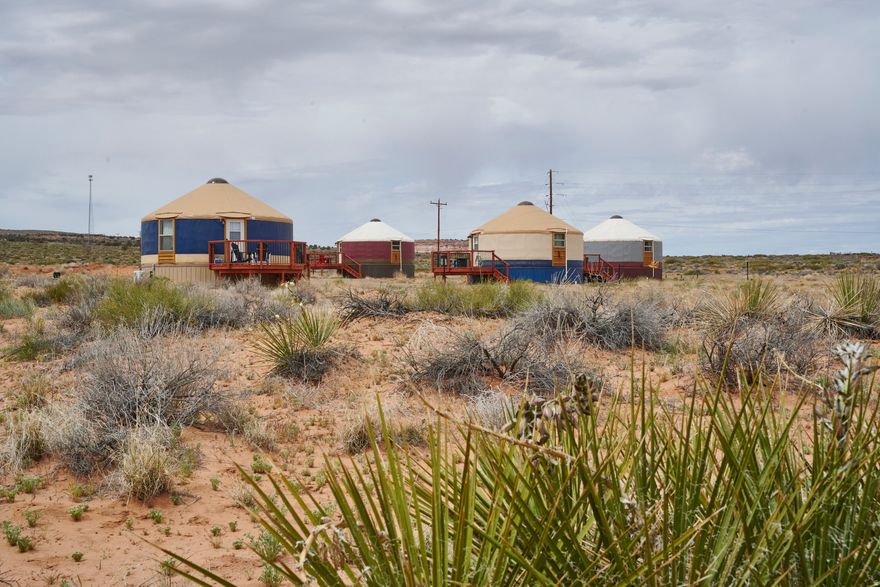 NOMAD YURTS, in Big Water, Utah.  Discover a rare investment opportunity just minutes from Page, AZ , near the stunning shores of Lake Powell, the Big Water Visitor Center, and a world-renowned region. Situated on 2.93 acres, this unique property features 4 fully finished, turnkey luxury yurts, each thoughtfully designed for comfort and style. Every 450 sq ft yurt includes high-end furnishings,  a full bathroom, granite countertops, septic and water connections, and modern amenities such as heating, air conditioning, and WiFi. Three of the luxury yurts are equipped with electric fireplaces, and all 4 units come fully furnished with refrigerators, microwaves, coffee makers, farmhouse sinks, and convenient kitchenettes. Built with a durable combination of wood framing, concrete, aluminum, and canvas, these luxury yurts offer both charm and longevity. The property is fully prepped for expansion, with infrastructure already in place to accommodate up to 12 total yurts. Septic sewer service laterals, electric, and  culinary water lines have been run to future sites, and building pads are already prepped and prepared, making it easy to scale and maximize your investment. There are material for a fifth yurt on site. Just needs to be built. The yurts have also been listed on short-term rental sites, demonstrating strong potential as a rental or glamping destination. With its prime location, existing infrastructure, and expansion readiness, this is an exceptional opportunity for investors looking to create a unique hospitality experience in a highly desirable area. THIS LISTING IS ALSO FEATURED ON THE MLS UNDER RESIDENTIAL.  Please visit the Nomad Yurts website  https://nomad-yurts.com