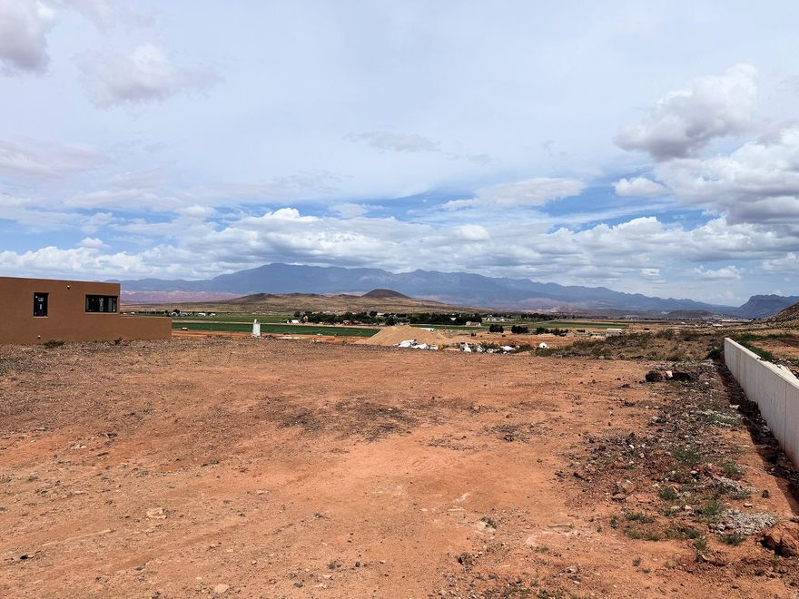 Large lot with spectacular views in Rock View Subdivision.  Bring your own builder. Horse friendly and views galore. Located in the Hurricane Fields area and close to Copper Rock golf course, enjoy similar views for a fraction of the price. No HOA and endless opportunities.  This lot won't last.
