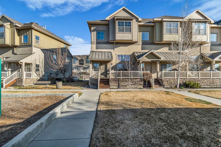An incredible end unit townhome just steps away from beautiful Utah Lake. Built in 2005 and thoughtfully cared for, this home offers a ton of value, with three bedrooms and two and a half bathrooms and a two-car garage, under $400k. This is a townhome that feels bright, functional, and easy to live in from the moment you walk in. Stepping inside, you are welcomed by an open main living area with 15 foot ceilings and floor-to-ceiling windows that fill the main level with natural light. The layout connects the living room, dining space, and kitchen with a short set of stairs. Large windows in the dining room carry the daylight into the kitchen, creating a warm and inviting atmosphere that works well for relaxing at home or hosting. The kitchen offers plenty of cabinet storage and counter space, along with a layout that keeps everything easily accessible while still staying connected to the rest of the main floor. The dining area sits just off the kitchen, making the space ideal for gatherings or everyday living. The first of three bedrooms is conveniently located adjacent to the dining room providing flexibility for use as a bedroom, guest bedroom, or a home office setup. The homes half bathroom is on the middle floor which adds to the functionality of the layout. Upstairs, you'll find two additional large bedrooms with an efficient and well designed layout. The primary suite features its own private bathroom and walk in closet, creating a quiet retreat at the end of the day. An additional bedroom and another full bathroom provide flexibility for occupants or guests. One of the standout features of this home is its location within the community. Positioned directly next to the neighborhood playground and pavilion, the property offers open views and easy access to outdoor space that is perfect for gatherings, playtime, or simply enjoying the neighborhood atmosphere. The attached two car garage is rare in this price range and provides plenty of parking and storage, while the surrounding Spring Creek Ranch community offers amenities including playgrounds, picnic areas, tennis courts, pickleball courts, and walking paths. Located just minutes from Pioneer Crossing, I-15 access, shopping, dining, and entertainment, this home combines convenience, functionality, and community living in one of Lehi's most desirable areas. Square footage figures are provided as a courtesy estimate only and were obtained from county records. Buyer is advised to obtain an independent measurement.