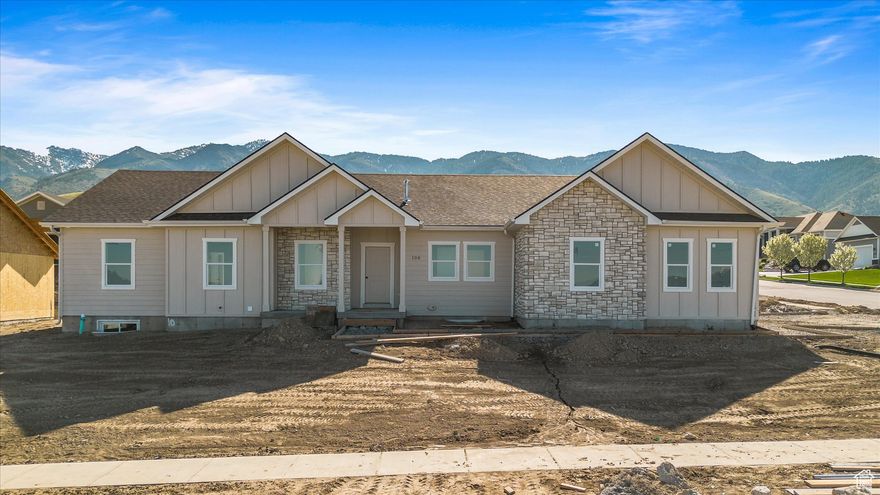 Brand-New Rambler with Valley Views in Hyde Park! This fully finished 3,550 sq ft rambler offers 6 spacious bedrooms and 3 full bathrooms, with 3 bedrooms on each level. Enjoy stunning views of Cache Valley from this .32-acre lot. The basement includes a large living space and a convenient kitchenette-perfect for guests or entertaining. Located in a quiet, desirable neighborhood, this new build combines modern style with functional design.   Square footage figures are provided as a courtesy estimate only and were obtained from the floor plans. Buyer is advised to obtain an independent measurement.