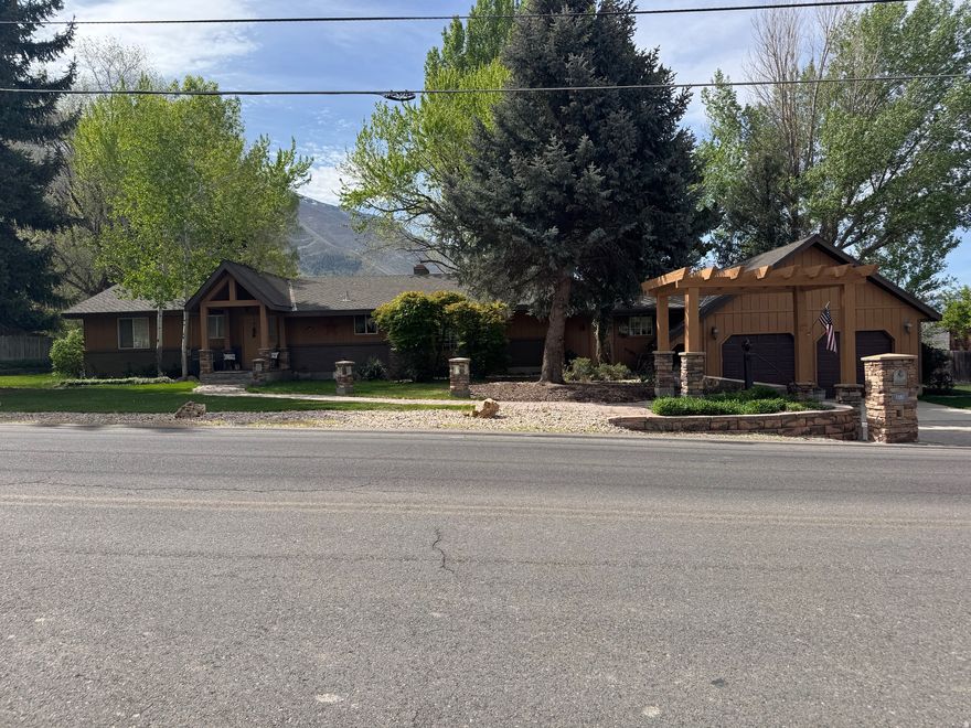 Beautiful well maintained home. Original owner. A lot of pride in ownership. 4 bedroom, 2 full 1 3/4 bathrooms. Large master bedroom with walkout to deck to hot tub. Master bath has separate tub and shower. Tub is a large jacuzzi tub. Open living and dining area. New stove, refrigerator and dishwasher. One gas log fire place with 2 wood burning stoves. Wonderful views of the mountains and sky from solarium with wide open windows to view from. Large 2 car garage with shop. Basement entrance for possible mother in law apartment. Very private backyard with no neighbors. Very peaceful and quiet.