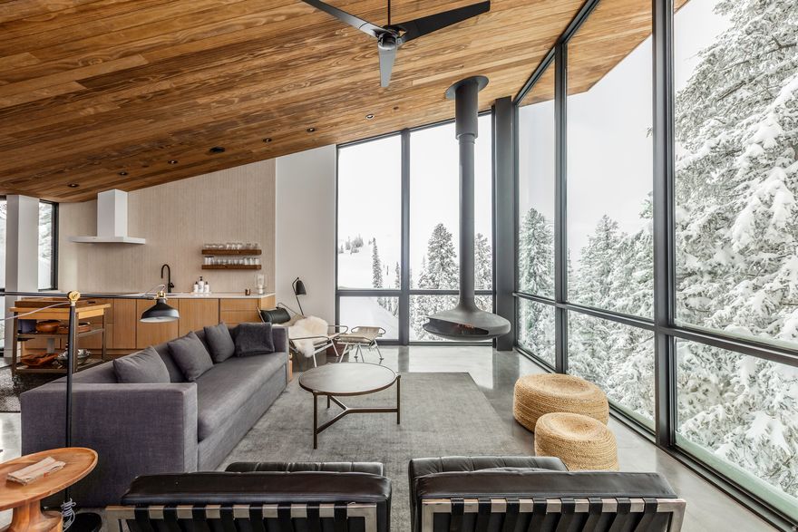 Due to the high level of interest in this home, the seller requests that all offers be submitted by Saturday, January 24, 2026 at 5:00pm Mountain Time. The seller plans to review all offers after that time.  Designed by Imbue Design, this fully furnished residence offers direct ski and snowboard access with an advanced-entry trail just steps from the door. The thoughtful layout combines function and style with beautiful finishes, curated furnishings, and recent upgrades. High-end appliances, ample storage, and refined details make this home as practical as it is elegant. Expansive northeast-facing views fill the home through floor-to-ceiling windows, highlighting a striking free-standing floating wood-burning fireplace.