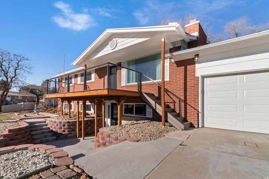 UPDATED and absolutely stunning, this MOVE-IN READY home is perfect for a family and/or potential renters. Main level is fully updated, offering peace of mind and modern comfort throughout.  Situated on a spacious .38-acre east-facing lot, this home offers beautiful Wasatch Mountain views from the deck and family room. The main level includes 3 bedrooms, 2 bathrooms, and an 11x11 enclosed sunroom. Downstairs is prepped and ready for your custom completion, features a separate ground-level entrance offering the opportunity for mother-in-law or renting potential. Located in a prime South Jordan neighborhood, you're just minutes from top-rated schools, shopping, dining, entertainment, quick access to I-15, and walking distance to the Jordan River Trail.    The home features COUNTLESS UPGRADES both inside and out. The Main Level has been completely redone. The kitchen shines with new countertops, disposal, dishwasher, microwave, and durable 22-mil LVP flooring that flows throughout the home. Both bathrooms are fully renovated with new tile, tubs, fixtures, vanities, and a luxurious curbless master shower. All new switches and outlets, new interior doors and trim upstairs, new LED lighting, and fresh interior and exterior paint.  Additional upgrades include a new water heater, new blinds in the bedrooms, master bath, and kitchen, and a fully re-done sunroom with added upstairs laundry.  Brand-new exterior doors and upstairs windows, completely 100% new plumbing from the main water supply to the sewer line.      Major structural improvements include a lifted foundation with pillars and new extra large footings, a window well added for future basement bedroom egress, and a regraded backyard for proper drainage. It also features a new deck, new garage door and opener, and fifteen paid-off solar panels are included in the sale.    The large lot offers excellent potential for an additional ADU, adding even more value and flexibility. The maintenance-free front yard is fully landscaped, providing beauty with minimal upkeep. This is a rare opportunity to own a turnkey home with extensive upgrades and incredible future potential.  Buyer & Agent to verify all information. Square footage figures are provided as a courtesy estimate only from the tax date. Buyer is advised to obtain an independent measurement.