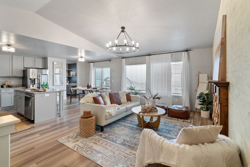 This modern farmhouse has all the vibes-fully finished, beautifully styled, and absolutely ready to show off. The great room brings the drama with soaring vaulted ceilings, designer lighting, and a custom feature wall. The open kitchen is a total mood, featuring highend finishes and the cutest coffee bar/study nook for brighter mornings. Custom woodwork and accent walls add personality throughout. Step outside on the beautiful stamped concrete to a fully fenced backyard with views for days and plenty of space for toys, animals, and fun. And yes-the smart fridge and home gym are included! A home with charm, character, and all the perks. It's a 10/10... come see it, love it, buy it!