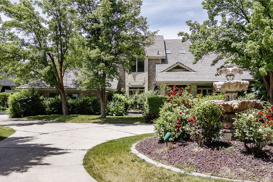 Own a stunning traditional home nestled back on .78 acres of 2 picturesque lots in scenic Quailbluff on Cliffside. Designers call this approach "transitional design", you update but keep the heritage of the home. Unparalleled privacy, overlooking the 'island' and historic landmarks with unobstructed views of Utah State University. The 2-story, all brick home, encapsulates everything. Often referred to has the "Laub's or Hampton's home", this 7480 sq. ft, with it's marble floors, grand staircase, tall ceilings, craftsman woodwork, etc.. has the best vibes ever. The primary suite is almost 1000 sq. ft with its fireplace, sitting area, balcony, dual walk-in closets and a grand size bathroom. The floor plan is easily adapted to personalize your vision and lifestyle. Park and Playground are up the street. You can't find a lot like this anymore and the views are priceless!!!