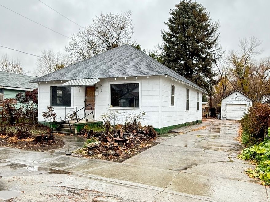 This darling 2-bedroom home is awaiting you.  Priced to Sell! With a fresh start, this home has great potential.  Main level living, laundry on the main floor. Basement storage with an extra bonus room and 3/4 bath. Large deep yard on .28 acres, some fruit trees, two shares of Pioneer 2 Water.  Detached garage, several storage sheds.    Square footage figures are provided as a courtesy estimate only. Buyer is advised to obtain an independent measurement.