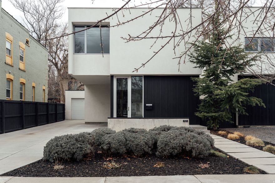 Those of us who love design and architecture know the difference between a contemporarystructurebuilt cheap for profit and an intentional home created for the enhancement of the inhabitants. This house is well proportioned, intelligently drafted and crafted, and simple in its beautiful function. I love being impressed when it comes to home. This gem has sat on that list for a long while-homes that get it right when it comes to small lots, low maintenance, and city living. Maximizing livabilitywithin a reasonable footprint, this house could be a course.And the space does all the teaching, no words needed. But in case you want a few details, here are some from my friend and colleague who also loves this house.  "Right in the center of it all, yet quietly tucked into its own rhythm, this modern retreat delivers clean lines, thoughtful design, and effortless living. Built in 2014, the home still feels new-roof, systems, and appliances all in excellent condition-offering peace of mind wrapped in polished style.Inside, tall ceilings (9' throughout) and an airy open-concept main floor create a sense of volume and light that feels both expansive and inviting. The kitchen, dining, and living spaces flow seamlessly together -- anchored by custom cabinetry, quartz countertops, and high-end finishes that elevate everyday living. A 12-foot sliding glass door stretches across the back wall, blurring the line between indoors and out and filling the space with natural light.Upstairs, three well-proportioned bedrooms provide privacy and comfort. The primary suite feels intentional and refined, while a convenient half bath on the main floor makes hosting easy.Xeriscaped landscaping keeps maintenance minimal and weekends wide open. A one-car garage offers rare extra parking for this ultra-central location.Modern. Connected. Move-in ready.This is an oasis in the city-designed for living well." -- Jennifer Hadfield And in case you are wondering if a move is necessary, a new lifeready here atthis stable structure, there is indeed a fireplace to keep you warm when modernism feels ready for the heat. Cool is great, but a good house is also hot.