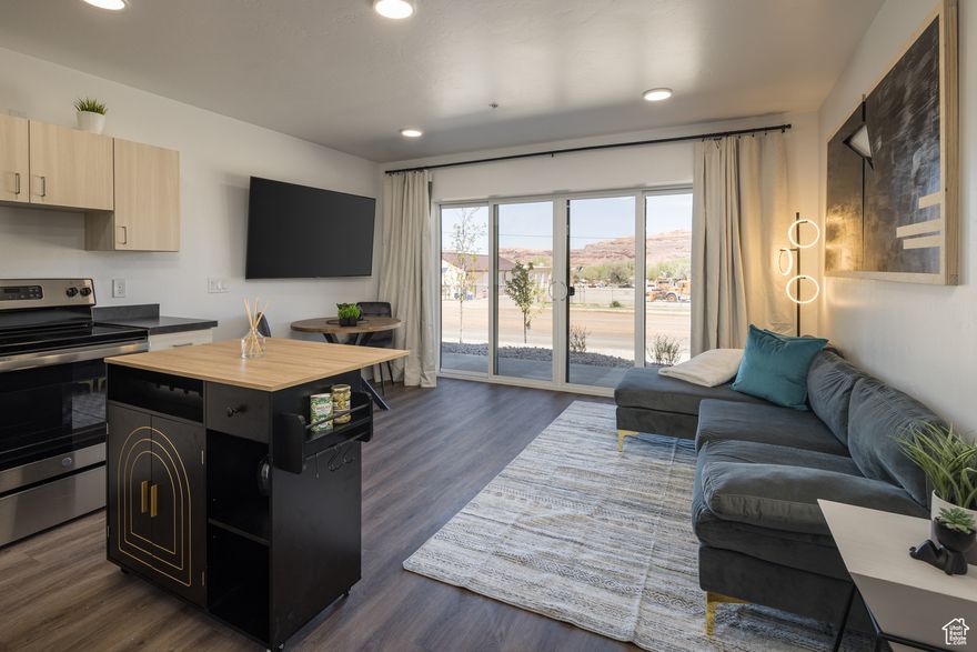 TOP FLOOR CONDO LIVING! Located on the recreational pathway of Kane Creek Boulevard and only a short stroll to downtown and all that Moab has to offer. Located at the base of the Moab Rim, this one bedroom, one bathroom residence offers stunning views of towering red rock cliffs and the expansive Moab Valley. Features include modern finishes, wood grain vinyl luxury tile, independent laundry, and a dedicated parking spot, as well as access to dispersed parking and bike racks. Enjoy morning sunrise and evening sunsets from your private balcony. Only minutes from the Pipe Dream trailhead, Moab Rim, Moonflower Canyon, and more, you'll enjoy the convenience and adventure at your doorstep! *Interior photos are of a similar unit.