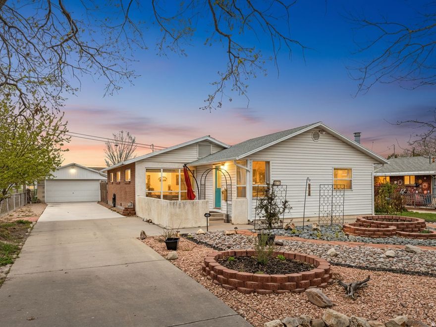 Darling Rambler! This charming home features a spacious family room with a cozy wood-burning stove and beautiful hardwood floors throughout! The large kitchen offers butcher block counters, a tile backsplash, center island, stainless steel appliances, and a gas stove-perfect for entertaining!  With four bedrooms and two full baths, there's plenty of space for everyone! Enjoy the convenience of a mudroom with tile flooring and a dedicated laundry room (washer and dryer included).  The xeriscape front yard offers great curb appeal with low maintenance landscaping and a welcoming patio, that is perfect for relaxing and enjoying the outdoors! Out back, you'll find a lovely yard complete with flagstone paths, a firepit, and more!  With ample parking plus a two-car garage with an attached storage shed, this home is a rare find with great functionality. Lots of windows with tons of natural light!  It's a GEM!