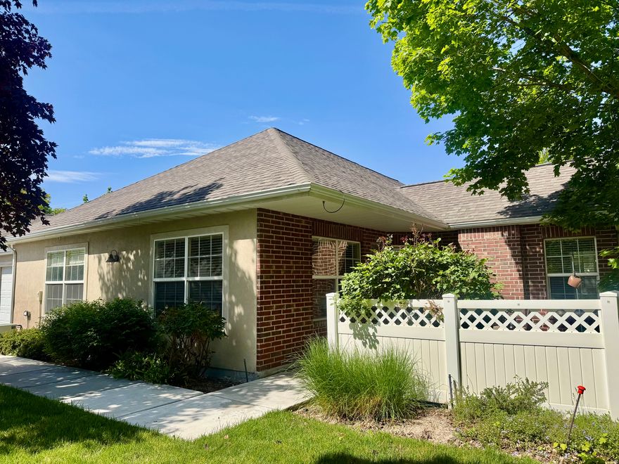 Beautiful 55+ condo in the highly desirable Jordan Villas community in West Jordan! This spacious 2 bedroom, 1 3/4 bathroom home offers 1,235 square feet of comfortable single-level living with an open floor plan, vaulted ceilings, a cozy fireplace, wide hallways, and wide doorframes designed for convenience and accessibility. The spacious master suite features a walk-in closet and private bath.  This very quiet and private community is known for its peaceful atmosphere, very friendly neighbors, and unique setting surrounded by grass and green space instead of busy roads. This well-maintained home has had only two owners.  Recent updates include a brand new roof in 2025, with all community roads scheduled to be resurfaced next year. Sidewalks are inspected yearly for safety hazards, adding additional peace of mind. Residents also enjoy access to the HOA clubhouse featuring a heated pool, fitness center, and picnic/BBQ area. Enjoy low-maintenance living in one of West Jordan's most beautiful and welcoming 55+ communities.