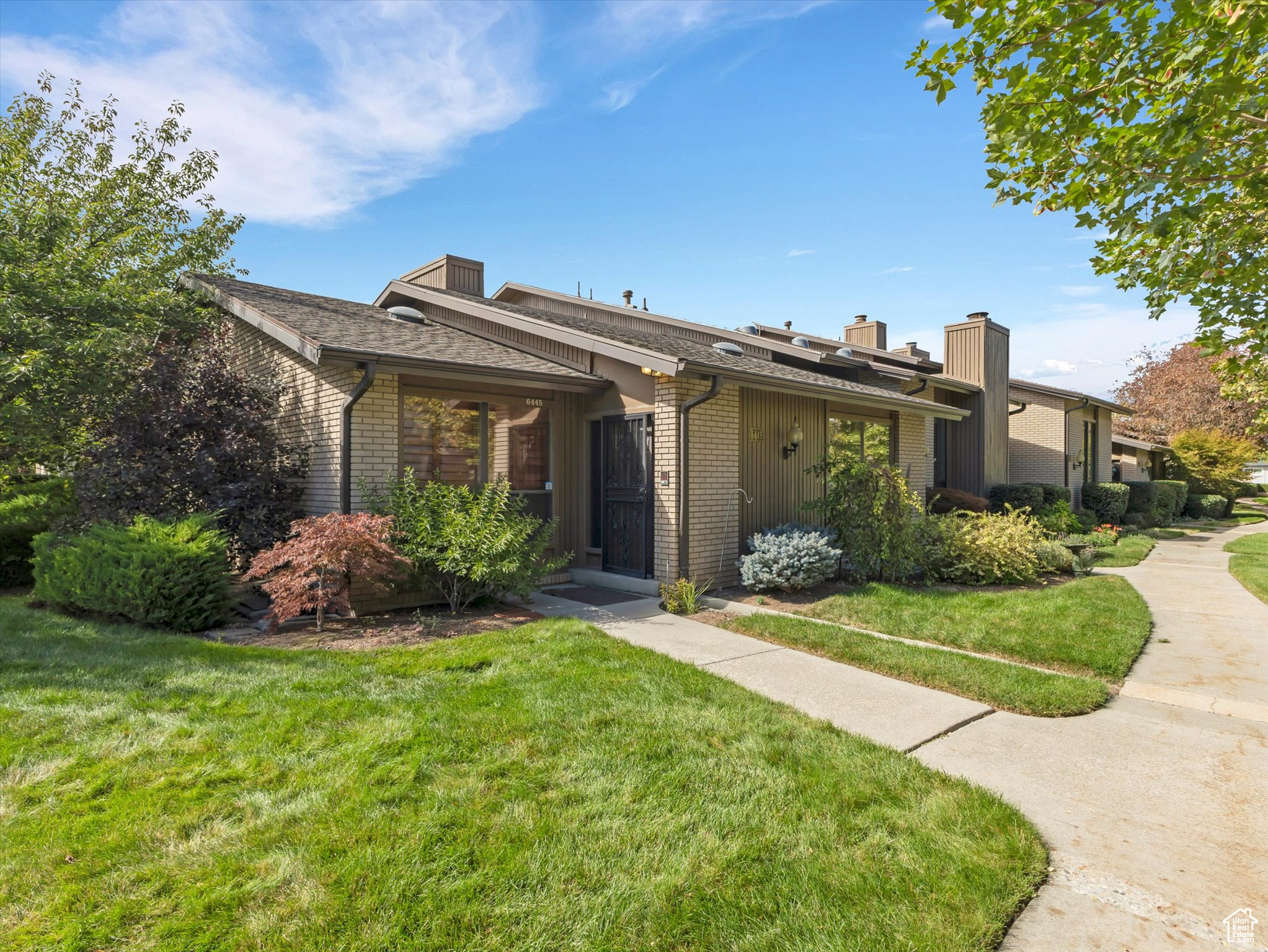 This appealing townhome offers main-floor living, laundry, a dedicated study/office with a cozy fireplace,dining and living area with cherry floors , master bedroom with a updated shower & and double sinks.This beautifully redone kitchen has SS Appliances and White Cabinetry with access to private patio. Additional 2 Bedrooms ,Bath,Study Nook and Family Room in expansive Lower Level with its own entrance. Abundant storage with Shelves.Enjoy all the perks of community living with access to the meticulously manicured grounds that include streams,ponds and fountains. Plenty of guest parking with an assigned outdoor space next to oversized 2 car garage.
