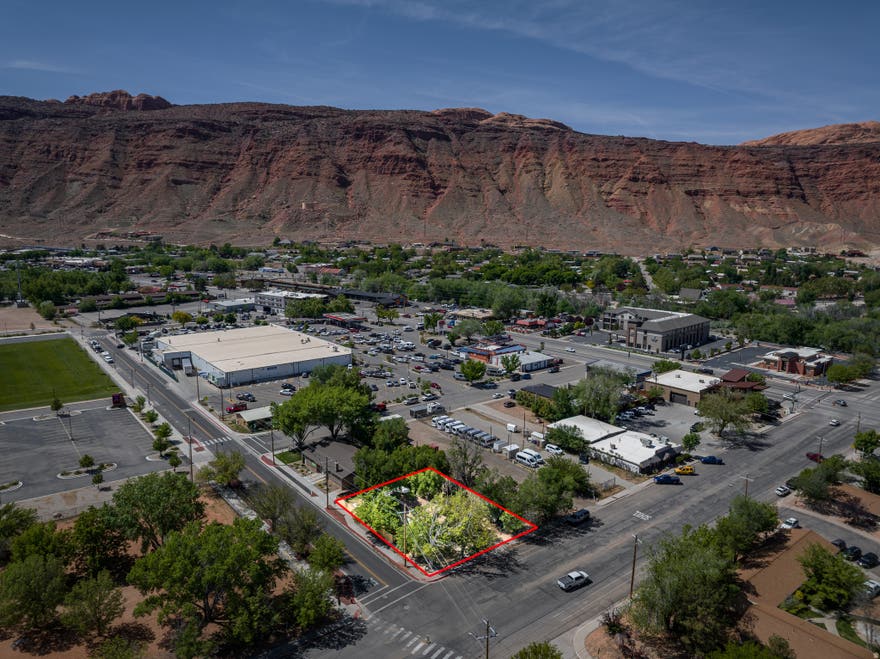Amazing Commercial Redevelopment Opportunity - This .20-acre parcel located in Moab's central commercial district is surrounded by established commercial activity and strong pedestrian and vehicle traffic. The site offers clear long-term upside for commercial or mixed-use development. There's an existing residence on-site with flexibility for interim use. Limited availability in this core location makes this a strategic acquisition opportunity for developers and investors.