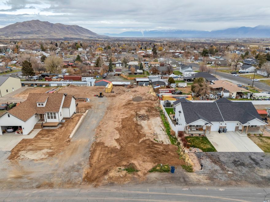 Mountain-View Homesite - Build-Ready! Discover the perfect opportunity to create your dream home on this nearly half-acre lot, already stubbed for water, power, and sewer-saving you both time and expense. The gently sloped terrain offers beautiful mountain views and a peaceful setting, while still being conveniently close to in-town amenities. The seller is a licensed builder and is available to construct a custom home tailored to your vision. Whether you're ready to break ground now or planning for the future, this property offers the space, views, and infrastructure you need to bring your dream home to life. Don't miss this exceptional opportunity-contact us today for details or to schedule a site visit!