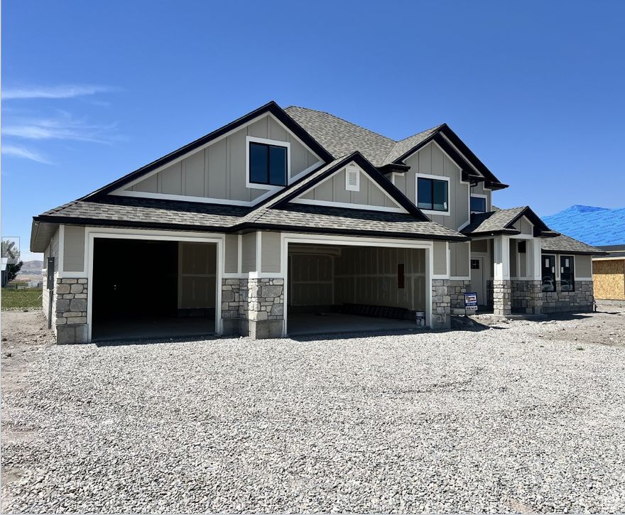 Outstanding Luxury Two Story Custom Designed Home in New Subdivision, Two Hi-Efficient Heating and AC Systems, 2X6 Wall Consytruction, Seventeen-Foot-High ceiling in Family Room, Butterfly Island Bar in Kitchen, Granite Countertops with Leather Finish, Covered Patio, Custom Cabinets and 5 Inch Trim, Roughed in for Water Softener, 4 Car Garage, 50 Year Architect Shingles, 340-foot-deep lot for whatever you want. This is the home you have been looking for.