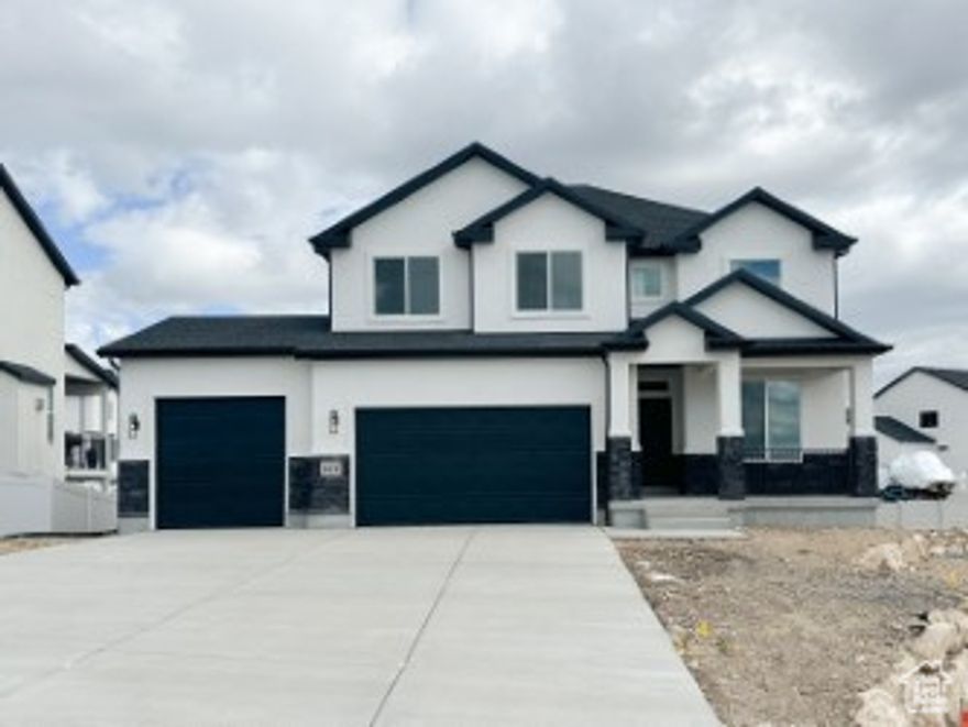 This stunning luxury home offer an exquisite blend of elegance and functionality, featuring 4 spacious bedrooms and 2.5 bathrooms.  The chef's kitchen is a dream with double ovens, a gas cooktop, hood and large island ideal for both cooking and entertaining. The Kitchen opens to an expansive living area, with a cozy fireplace creating the perfect ambiance. The open-concept design seamlessly flows into a covered deck, where you can relax and enjoy incredible view of the surrounding landscape. The walk-out basement provides ample space for recreation, with easy access to the outdoors. This home combines sophisticated design with luxurious comforts, offering both beauty and practicality in every detail.  Ask about our $21,000 Lender Incentive. Buyer to receive 4000 sq ft of sod.  Square footage figures are provided as a courtesy estimate only and were obtained from building plans.  Buyer is advised to obtain an independent measurement.