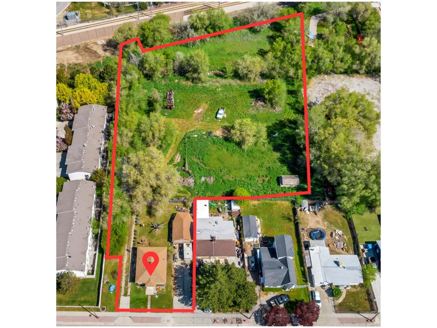 Looking for the perfect place to build your dream home and/or business? This charming 3-bd/1-bth bungalow/cottage on 1.43 acres, nestled in the heart of West Jordan, offers endless possibilities. The expansive property presents a canvas for your imagination, whether you're looking to renovate the existing home, build a new home, and/or additional structures for a thriving business-such as a studio, gym, shop, restaurant, or other type of service business! Currently zoned CC-F (city center frame) (See attached forms for what is allowed with current zoning). The property includes three separate parcels being sold together (parcel #21-34-181-005, #21-34-181-001 and #21-34-180-001 totaling 1.43 acres) with a detached garage, an old barn, and a shed. A canal runs through the back of the property, and water shares are included. Don't miss out on this rare opportunity to own a prime piece of property!