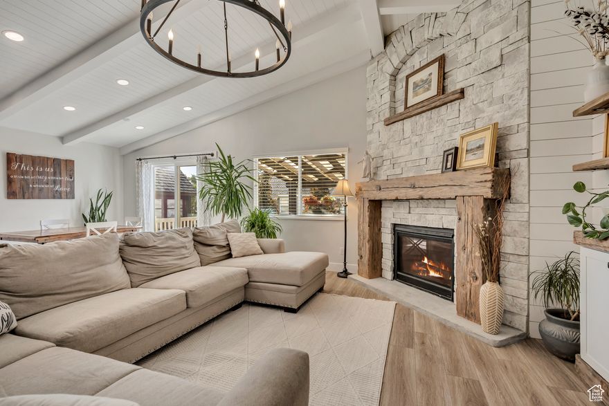 OPEN HOUSE 12/6 1:00-4:00 pm! New carpet on main level installed 11/26/2025! Carpenter's Delight! Step inside this classic rambler and immediately feel the craftsmanship, warmth, and attention to detail that's so hard to find today. Owned and cared for by a master woodworker, this home showcases exceptional quality throughout - from the stonework surrounding the fireplace to the custom ceilings, lighting, and intricate trim details.  The finished basement includes a second kitchen and even more custom woodwork, providing the perfect space for entertaining, guests, or multi-generational living. Outside, relax on the newer covered deck or take advantage of the spacious RV pad with plenty of room for your boat or trailer.  This home truly stands out - don't miss your chance to make it yours!