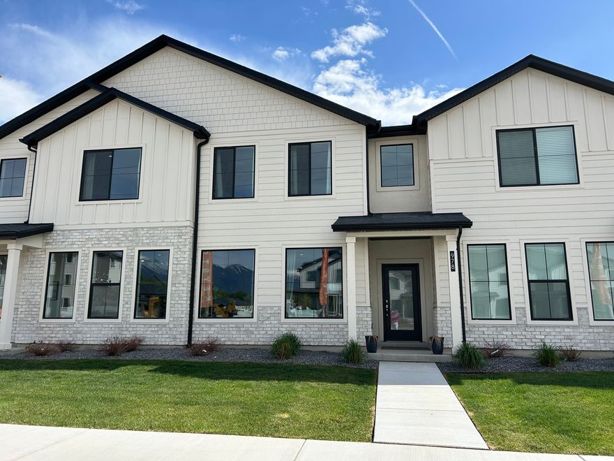 Beautiful Farmhouse style townhome is located in the desirable River Run Community and will be completed in February!  **Receive a $12,000 flex incentive to go towards closing costs or purchase price. Incentive is not tied to using builder's preferred lender. selections have been made by our professional designer and they are gorgeous! Home has 9' ceilings on the main level w/oversized picture windows, large, eat-in island and a super-sized pantry. Upper level offers spacious owner's suite w/ spacious bedrooms and adjoining loft. All sq. ftg. is above ground. 2-car garage. Exceptional Nebo School District. Less than 1 block from brand new Spanish Fork Rec Center. Close to rodeo grounds, shopping, baseball fields and schools. Please visit our model home @ 976 S. 200 E. Spanish Fork.