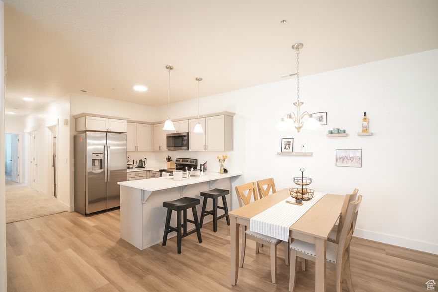 Welcome to your new home in Lehi! This condo is a place that?s equal parts stylish and practical, with just enough swagger to make you smile when you walk through the door. This single-level home dishes up 3 bedrooms and 2 bathrooms across 1,272 square feet of ?yeah, I can live like this.? The open concept great room and kitchen aren?t just functional they?re the kind of spaces that make you want to host dinner, or at least order takeout and pretend you cooked. The master bedroom  gives you the walk-in closet you?ve been quietly wishing for, along with en-suite that actually feels like yours (no sharing the sink battles here). Beyond your front door, the community makes everyday living feel like an upgrade. . We?re talking a clubhouse, pool, pickleball courts, playground, and basketball courts. Translation: plenty of ways to work out, chill out, or just show off your questionable three-point shot. Top it off with an attached garage, full landscaping, sidewalks you can actually walk on, and a location that keeps you close to everything Lehi has going on. It?s polished, it?s low-maintenance, and it?s waiting for someone with taste. That someone could be you, if you act fast. square footage provided as courtesy, buyer and/or agent to verify all.