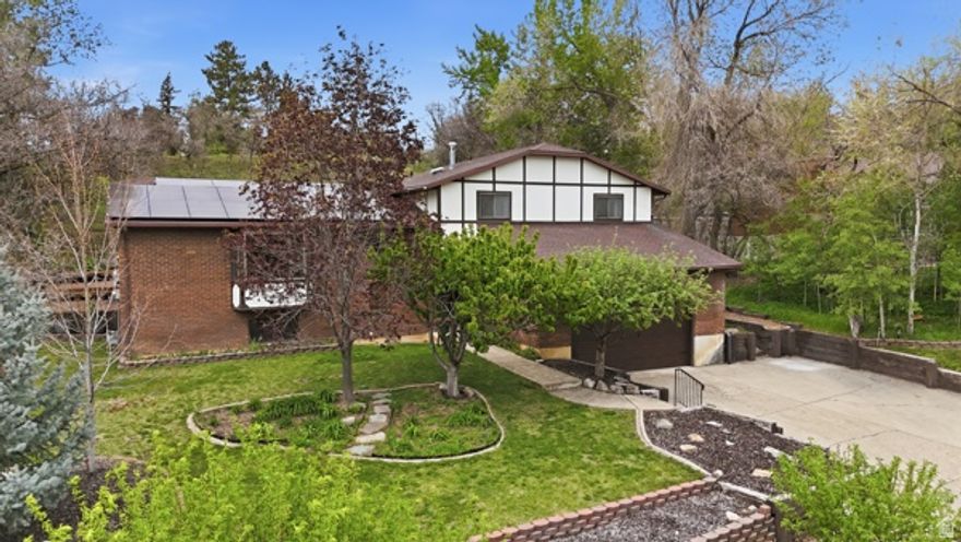 WOWZA! Check out this East Layton diamond nestled on a cul-de-sac amid million dollar homes!! Beautifully refurbished, this freshly painted gem features polished hardwood floors & brand new carpet thru-out! A major overhaul of the kitchen created elevated ceilings, recessed lighting & stunning cabinets! The large family room is highlighted by a new fireplace & tasteful built-ins! Remodeled Bathrooms appointed with dual sinks & granite countertops!  **STUNNING LANDSCAPE!**Fabulous garden beds! New exterior lighting! Expansive redwood deck! Multiple trees--laced & shaped--including Fruit trees! **PAID OFF SOLAR PANELS!** **$30K in NEW WINDOWS!**  **BRAND NEW GARAGE DOOR!** **CENTRAL VAC** **BREATHTAKING MOUNTAIN VIEWS!**  AGENTS: All Furnishings negotiable except beds. Paid off Soft Water system can stay. Stainless Washer, Dryer & Refrigerator can stay with fair offer