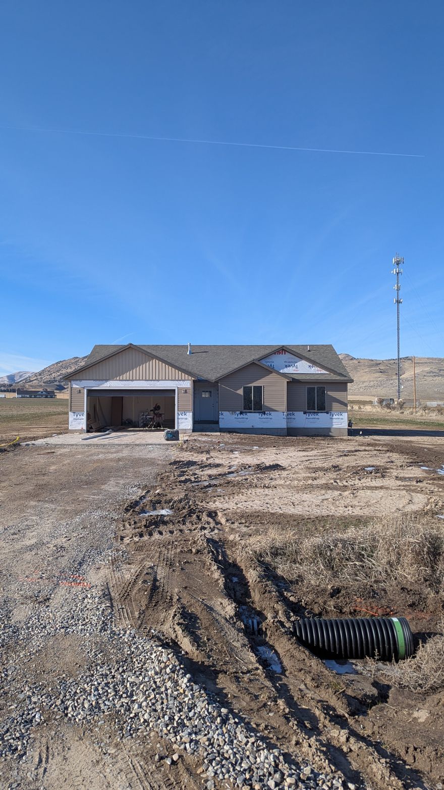 Great new construction located on a Large 2.0 acre lot in the quiet setting of Portage Utah, Bring your Horses or other animals!!  3 bedroom, 2 full bathroom home with vaulted ceilings. Custom cabinetry throughout with stainless steel appliances that include a French door refrigerator with ice and water, gas range, dishwasher and microwave oven. 2 Car attached garage that is insulated with an insulated garage door and operator. Make this home yours today!! 20 Minutes from Tremonton and 15 Minutes from Malad. Leave the BIG City behind for this rural quiet setting. Property taxes TBD Square footage figures are provided as a courtesy estimate only. Buyer is advised to obtain an independent measurement. Taxes have not been assessed with the new home on the property.