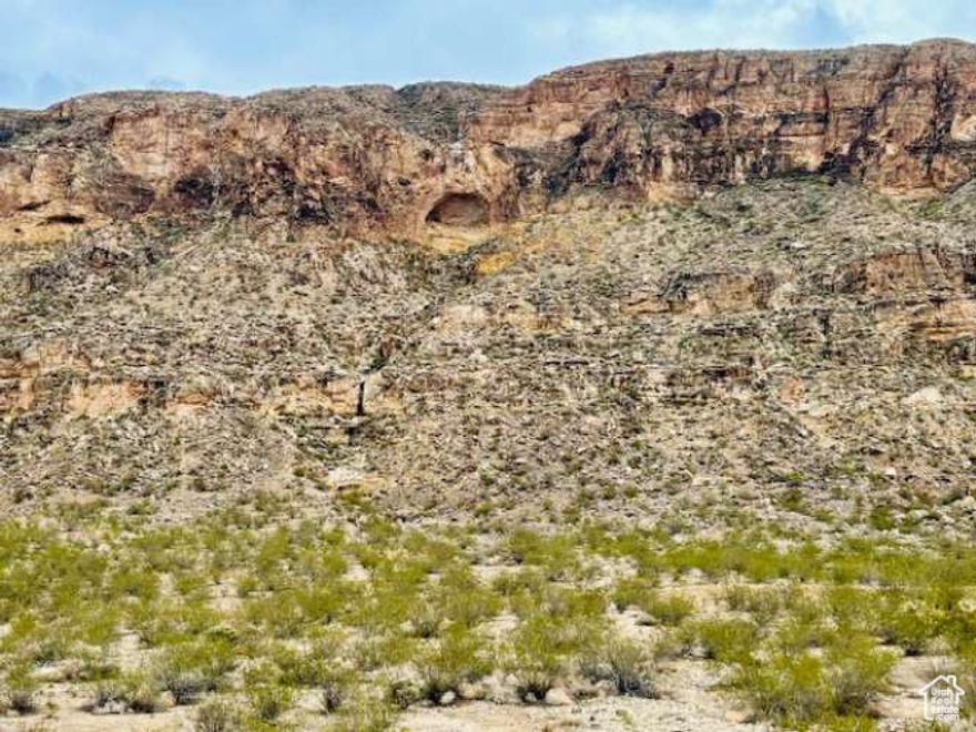 Searching for heavenly majestic views, panoramic sunsets, and peaceful surroundings to build your dream home? Welcome to Cliff Dweller Ranch, located across from the luxury Copper Rock Golf Community, just a few minutes from the charming town Hurricane, Utah. A premium lot with plenty of space to spread out and breathe the fresh air while enjoying your private courtyard. This 1.58 acre lot (68,825 SqFt) offers abundant space for privacy and solitude. Enjoy nearby hiking trails, spectacular Zion National Park, world class golf courses, biking, water sports, boating, skiing, and fishing just minutes away. This rare find is perfectly nestled against towering red Hurricane Cliffs and BLM property, offering privacy behind you and mesmerizing million dollar Utah scenery. It's time to grab one of the last lots in Cliff Dweller Ranch, and start building that dream home! Do not let this one get away!