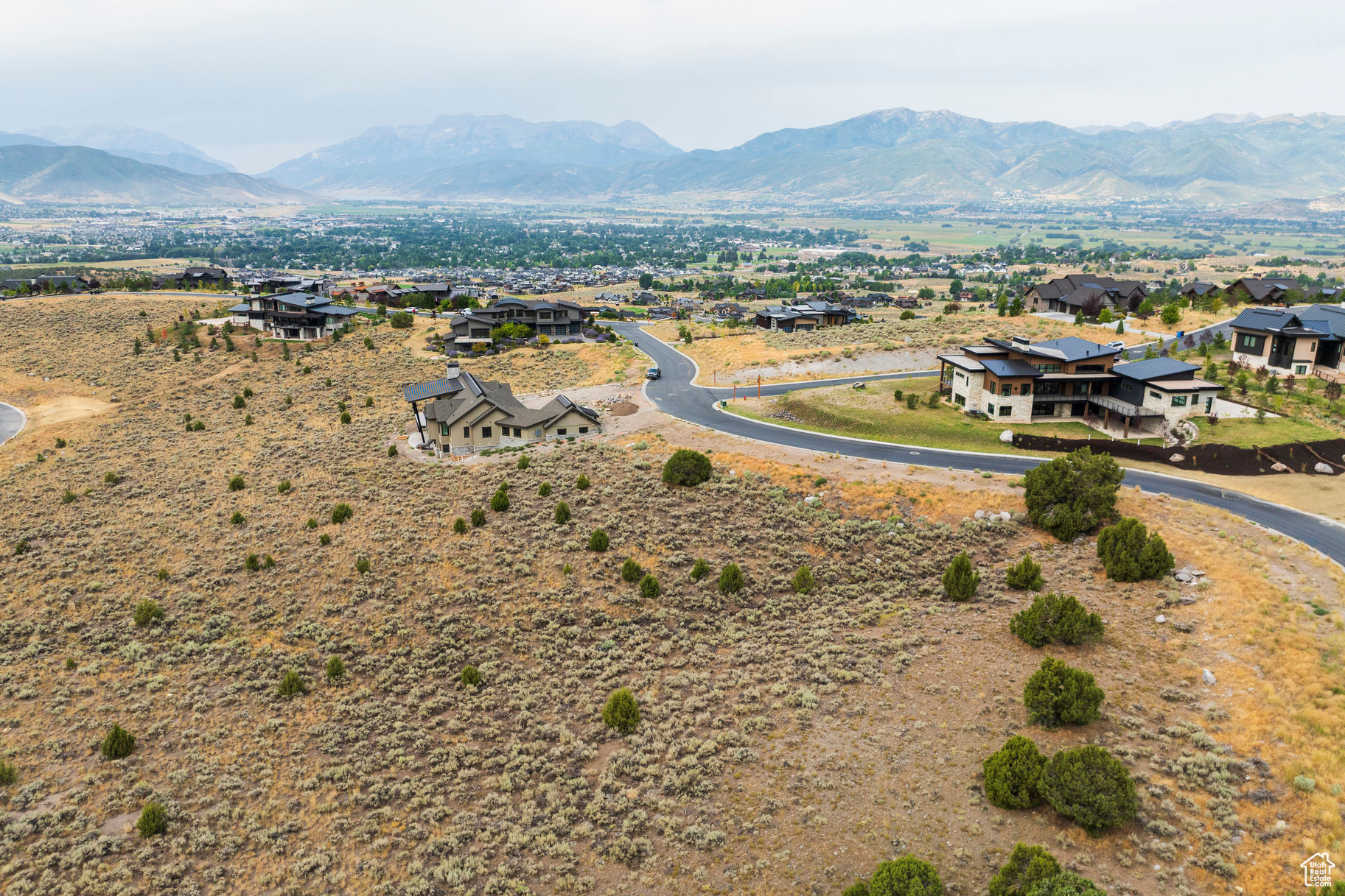 Nestled within the prestigious Red Ledges community, this stunning 1.18-acre lot offers the perfect canvas to build your custom mountain retreat. With panoramic views of the surrounding Wasatch Mountains and easy access to world-class amenities, this homesite combines luxury, privacy, and convenience. The gently sloped terrain allows for an uphill build to maximize views of Mount Timpanogos, while being ideally situated on a quiet, established street within the gated community. Included with the property is a full Red Ledges Golf Membership, providing immediate access to the award-winning Jack Nicklaus Signature Golf Course, clubhouse, fine dining, pools, tennis, fitness center, and year-round activities. Whether you're an avid golfer, an outdoor enthusiast, or simply seeking the tranquility of mountain living, this lot delivers the ultimate Red Ledges lifestyle-all within minutes of downtown Heber, Deer Valley Resort, and the new Deer Valley East.