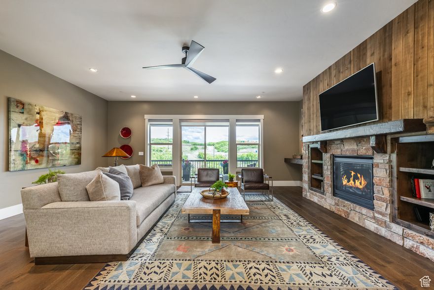 This is undoubtedly the best priced townhome in the entire Jordanelle area and the purchase comes with the first year of HOA dues paid at Closing by the Seller! Now offered at a reduced price of $1,050,000, it represents an incredible value with over $150,000 in upgrades. Located less than 10 minutes from Deer Valley's East Village and the Jordanelle Gondola, this private end unit is surrounded by natural open space with abundant wildlife and direct access to a private trail system. The open floor plan features four bedrooms, plus three and a half bathrooms, a warm and inviting Great Room with vaulted ceilings and recessed lighting, a custom stone fireplace and hearth, and a spectacular chef's kitchen with custom cabinetry, walk-in pantry, and large center island. The home was professionally designed and features extensive custom upgrades, including premium KitchenAid appliances, granite countertops with custom backsplash, gorgeous hardwood flooring, a Lutron automated lighting system, power shades, water softener with RO system, central humidifier, and designer light fixtures. Outdoor living spaces include a spacious front deck-perfect for morning coffee or sunset entertaining-and a private back patio offering a quiet retreat surrounded by nature. The oversized two-car garage was custom designed and built by Garage Living and includes cabinetry, a workbench, under-cabinet lighting, epoxy floors, and a flow wall for efficient storage of toys and gear. Whether you're looking for a full-time home or a refined mountain getaway, this move-in ready townhome offers style and comfort, at an unbeatable price!