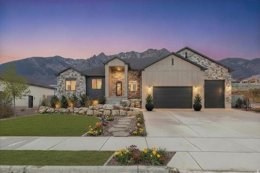 **Current incentive is up to $15k towards closing cost or landscaping credit w/Preferred Lender.** Stunning new Rambler with Great Views!! Completely finished up & down w/ADU options. The gourmet kitchen is very functional, yet modern in design. Featuring a 66" fridge/freezer combo, decorative hood vented outside, gas cooktop, double ovens, and a generous walk-in pantry-perfect for both entertaining and everyday living. Enjoy 9' ceilings on both the main level and basement, and relax in the great room with a cozy gas log fireplace. Primary suite with freestanding tub/large shower, double sinks and walk-in closet. Basement has another custom kit., 3 more bedrooms, 1 full bath and  second laundry room. Spacious 4 car garage equipped with an EV charging and RV pad already poured.