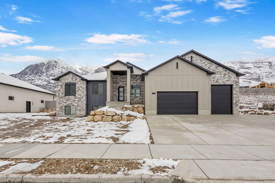 Stunning new Rambler with Great Views!! Completely finished up & down. Custom cabinets with knobs/pulls, soft close doors/drawers, granite/quartz countertops throughout, Gourmet kit., vaulted great room w/gas log fireplace and 9' ceilings on main/basement. Primary suite with sep. tub/shower, double sinks and walk-in closet. Basement has another custom kit., 3 more bedrooms, 1 full bath and  second laundry room. Spacious 4 car garage equipped with an EV charging outlet.