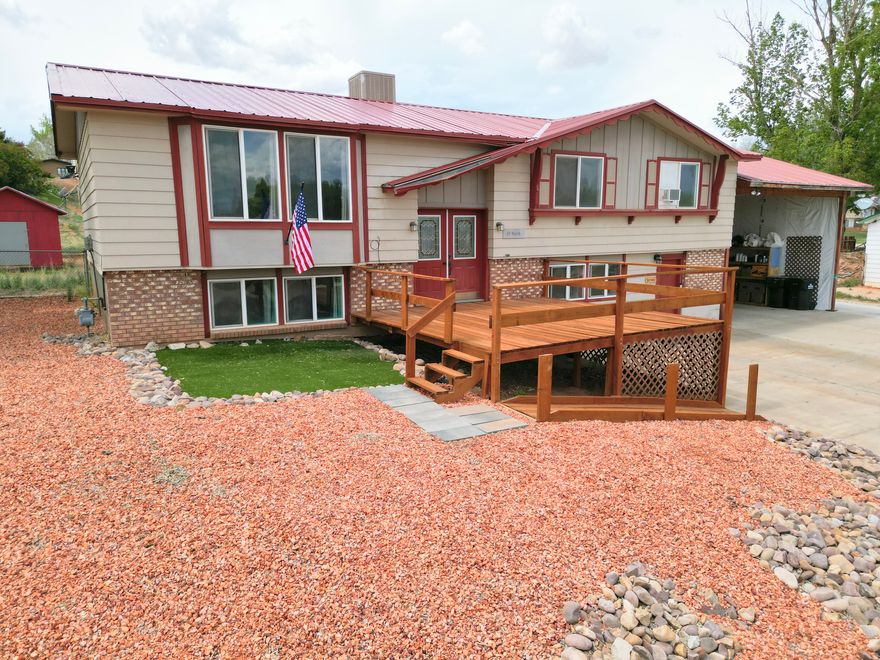 READY FOR NEW OWNERS! Don't miss this spacious 2,640 sq ft multi-level home situated on a generous .36-acre lot. Featuring 4 bedrooms and 3 bathrooms, including a roomy master suite with a walk-in closet, this home offers comfort and flexibility for a variety of living situations. With two kitchens and separate entrances, the possibilities are endless-ideal for multi-generational living, rental potential, or hosting guests with ease. Enjoy outdoor living with a large patio, deck, and a fully fenced backyard complete with a storage shed. The low-maintenance zero-scaped front yard adds curb appeal, while the enclosed carport provides additional usable space. Square footage figures are provided as a courtesy estimate only and were obtained from county records. Buyer is advised to obtain an independent measurement.