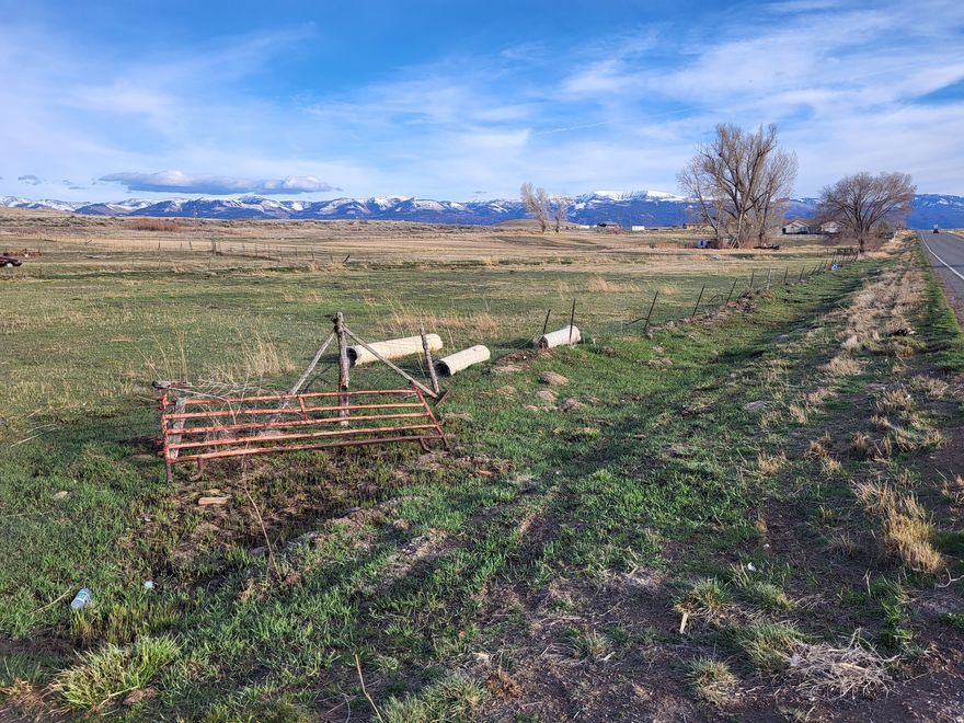 Nice piece of property with mature tree. and beautiful view;  has harvested approximately 100 small bales of grass hay per year and has yielded approximately 300 small bales of 3 way hay.;includes 5 shares of Horseshoe Irrigation water; updated irrigation head gates installed with furrow;  a water right would need to be purchased for culinary water; great location, just south of Moroni (property is on both sides of Highway 132). Google coordinates:  39.50978, -111.57046.
