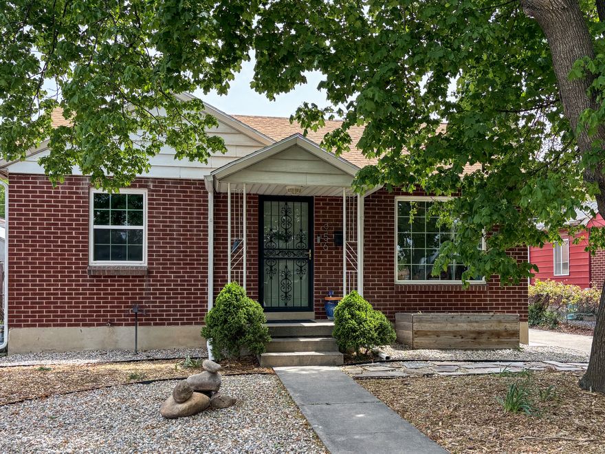 Don't let this one slip through your fingers.  Charming brick rambler with an updated kitchen including new tile flooring, gorgeous cabinets, quartz counter tops with beautiful tile backsplash, center island, new plumbing fixtures and new appliances.  The main bathroom has been updated as well.  The windows have also been updated and 2 new windows with required egress have just been installed in the basement.  There's a recent coat of paint throughout the home.  The home features an inviting front room with lots of natural sunlight and hardwood floors.  There are 2 cute bedrooms on the main floor along with the updated full bathroom as well as the newly renovated kitchen.  Downstairs you will find a large flex bedroom/family with a woodburning stove for added comfort.  There's room for an additional bedroom downstairs as well.  The mechanical room has a newer HVAC system for efficient heating and cooling along with a large laundry room with plenty of storage.  A 2nd bathroom is possible to put in downstairs as well.  Outside you will find an oversized 1 car garage that has additional great space for a workshop or hobby area w/power.  An open patio area, grassed area, raised garden beds and a storage shed/outbuilding provide a great place to play and relax in the privacy of your back yard.  Fiber is available in the area for high-speed internet service.  This is a move-in ready home.  Just unpack and sit back and relax!  With its great location and neighborhood and convenient access to I-15 you will love living here.  Square footage figures are provided as a courtesy estimate only and were obtained from County Records.  Buyer is advised to obtain an independent measurement.