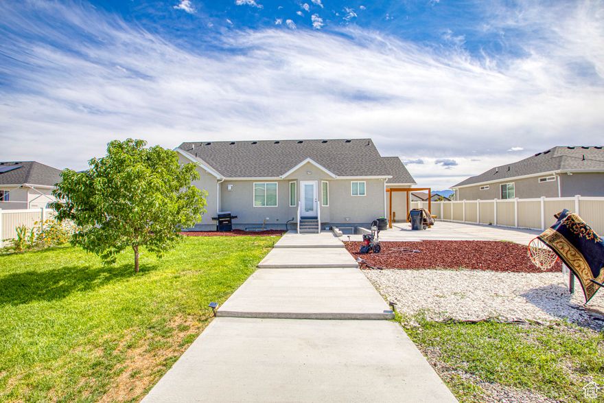 Beautiful home in Grantsville with an amazing view of the mountains from the backyard. Basement complete with private walkout entrance perfect for Mother In Law. RV parking included!