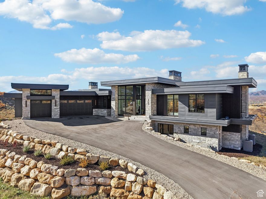 Located in Promontory-one of Park City's most prestigious golf communities-this stunning, contemporary new-construction home captures breathtaking west-facing sunset views that stretch from the Utah Olympic Park to Canyons Village. The warm, open floor plan features expansive windows, a chef's kitchen with a large butler's pantry, and over 3,000 sq ft of deck and patio space-perfect for entertaining or quiet evenings by the fire. Enjoy a private office with a view, a spacious family room, a main-level master suite and four additional ensuite bedrooms, each with a walk-in closet. Additional highlights include a movie theater, a large storage room (ideal for a wine cellar or golf simulator), and a three-car oversized garage woth .   Owners are not required to join the club, but Social, Golf, and Equestrian memberships are available. This home includes a transferable golf membership-skip the long waitlist! Promontory offers three golf courses, 11 clubhouses, private ski lounges, a beach club, and other world-class amenities. Promontory is conveniently located just 40 miles from Salt Lake City International Airport (highway only), 25 miles from the Heber Airport, and 13 miles from Historic Main Street Park City.  Information deemed reliable but not guaranteed. Buyer to verify all information.