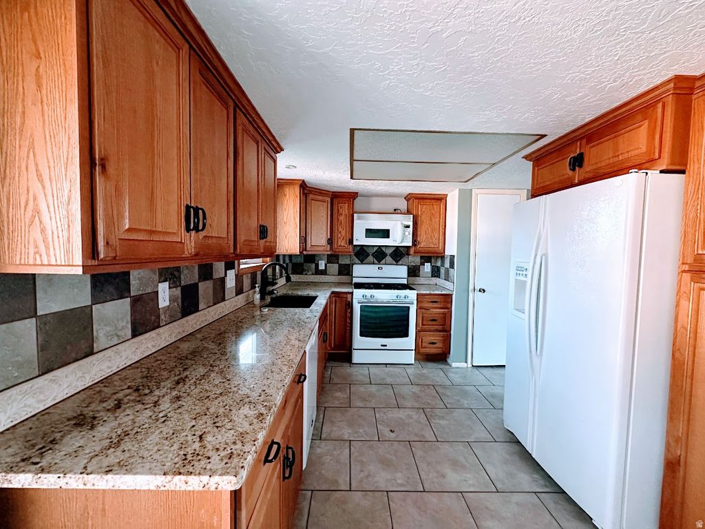 Photo of 1185 W 725 N, Clearfield, UT 84015 (MLS # 2156533)