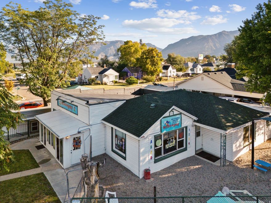 **Motivated Seller** Located in the heart of Ogden, this versatile 2,747 sq. ft. commercial property offers a rare combination of functionality, flexibility, and opportunity.  Previously used as a licensed daycare, the building is thoughtfully designed with open, well-lit spaces, multiple large rooms for group activities or offices, and a fully equipped commercial kitchen. Electrical, some windows, flooring and painting done in 2020 The layout supports a wide range of possible uses - from continued childcare or educational services to professional offices, medical, wellness, or community operations. Outside, you'll find ample parking including street parking, a fenced outdoor area, and excellent accessibility from nearby schools, neighborhoods, and major roads. Its central Ogden location provides strong visibility and convenience for clients, employees, or families. All appliances in property are to stay with property with the exception of the commercial fridge. Whether you're an investor seeking a solid income property or an owner looking for a ready-to-use business space, this property offers endless potential to fit your vision. Current use as licensed daycare; buyer to verify permitted uses with Ogden City